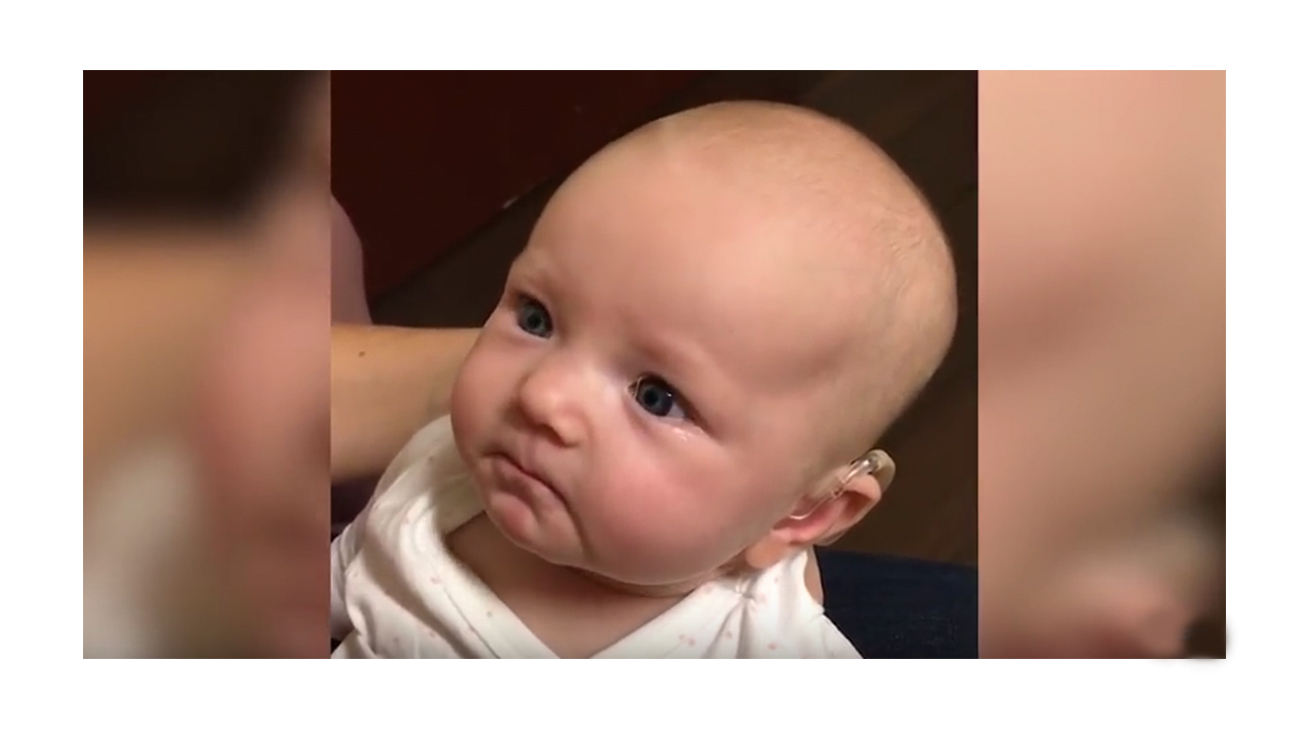 This baby hears for the first time - and her response is amazing